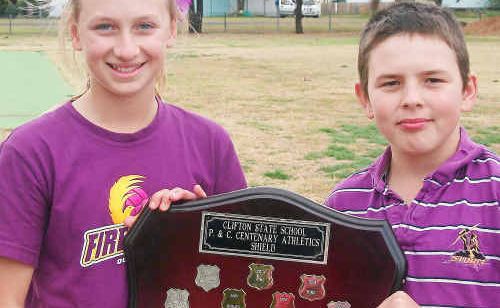 Winning Sibley House captains Sarah Mantova and Braydon Saville accept the Centenary Shield at the Clifton State Primary School carnival. Winning Sibley House captains Sarah Mantova and Braydon Saville accept the Centenary Shield at the Clifton State Primary School carnival.